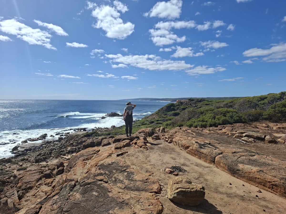 Franziska on the rocks, looking out to sea.