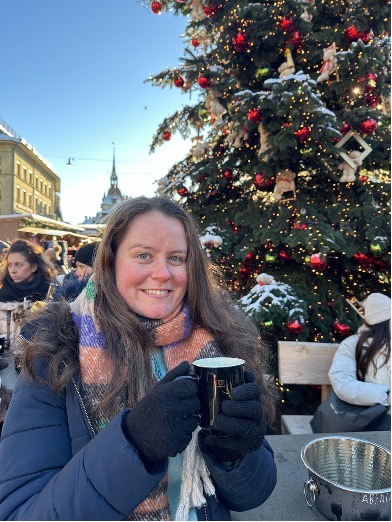 Beth Clarke enjoys a hot drink at a Christmas market.