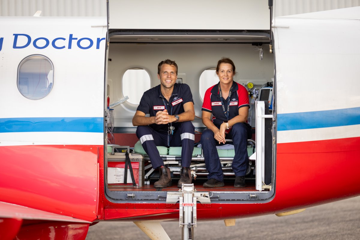 RFDS aeromedical crew in the doorway of a PC-12.