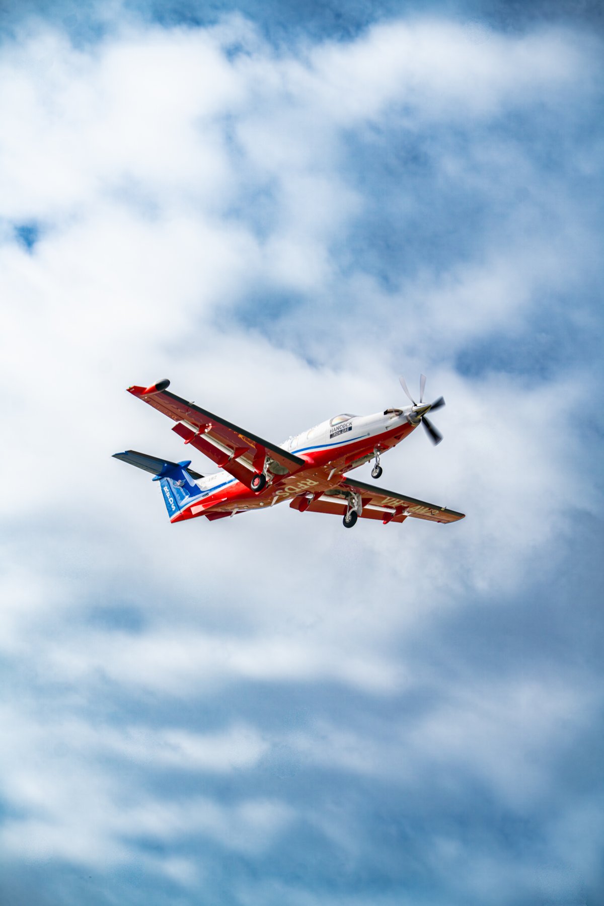 RFDS PC-12 against the clouds.